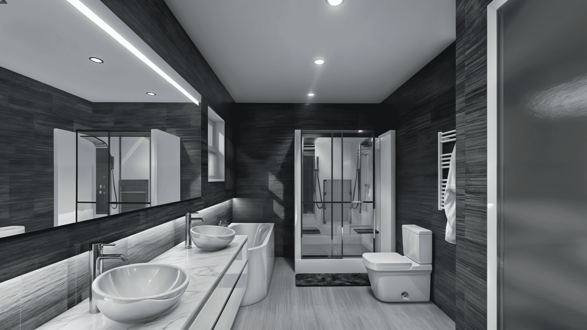 A modern bathroom features dual sinks with bowl-style basins, a large mirror, dark tile walls, a shower stall with glass doors, and a wall-mounted towel warmer next to the toilet.